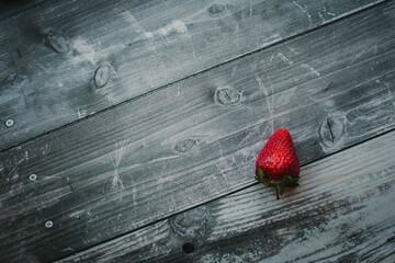 fresh strawberries lies on a gray background