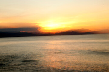 Fototapeta na wymiar Sunset in the sea in a summer day