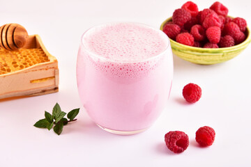 Natural healthy smoothie made from raspberry and coconut milk.