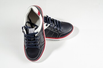 black sports shoes with white soles close up