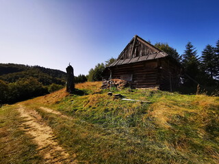 Old wooden house on a mountain road.