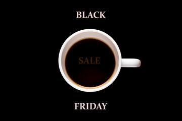 Black friday. White cup of coffee on a black background.