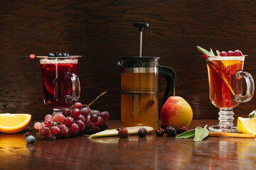 Various autumn or winter seasonal alcohol hot cocktails. Blueberry mulled wine, tea with pear and...