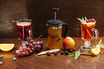 Various autumn or winter seasonal alcohol hot cocktails. Blueberry mulled wine, tea with pear and...
