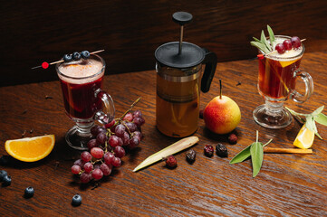 Various autumn or winter seasonal alcohol hot cocktails. Blueberry mulled wine, tea with pear and...