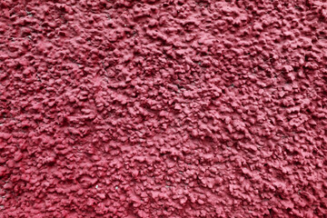 Popcorn ceiling texture of a red wall with color - rough surface background	