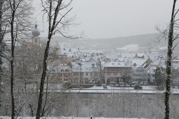 Fototapeta na wymiar cityshape of snowed marktheidenfeld with main river