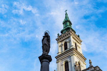 Fototapeta na wymiar Barczy Istvan St street and St. Anne Church. Budapest downtown lifestyle in a gloomy november day.