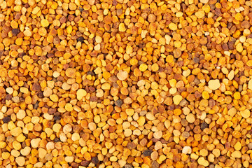 Flower pollen grains background. Pile of bee pollen or perga.