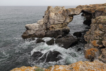 Amazing seascape at stone arch cliffs near Tyulenovo village, Black Sea, Bulgaria