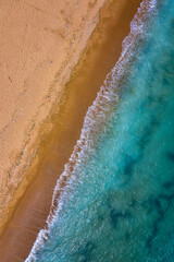 Top view aerial photo from drone to the beautiful sea and yellow sand.