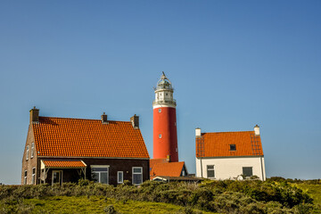 Fototapeta na wymiar Lighthouse 'Eierland' near the Cocksdorp in the north of the Wadden Island Texel, Holland.