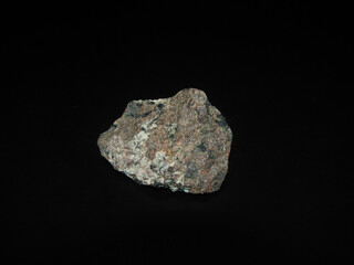 Sample of rock molibdenite on a black background