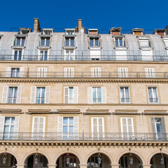 Fototapeta na wymiar Paris, the beautiful Rivoli street, typical facade and windows 