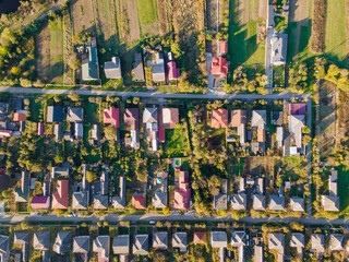 Beautiful village house in a small village in top aerial view small green village from above with fields
