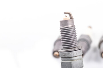 Studio lighting. spark plug from a gasoline engine. It is matte. Close-up.