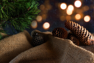 Natural christmas decoration
Natural christmas decoration with pine cones on rustic linen sack....