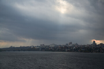 View of the right bank of Voronezh from the North Bridge in the rain