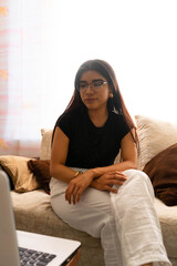 woman in online classes with her laptop