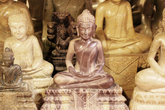 Several sculptures of the contemplating seated Buddha, 3