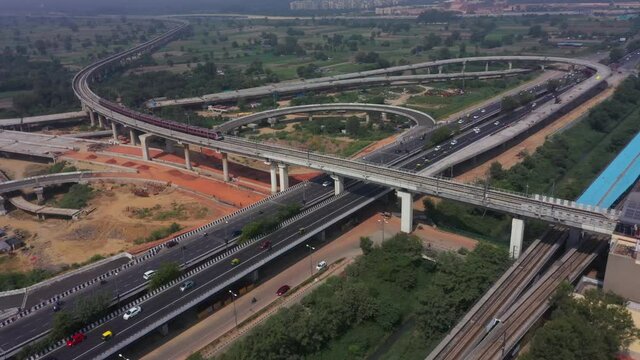An aerial shot of the Two Delhi Metro Trains crossing each other at Mayur Vihar, New Delhi, India