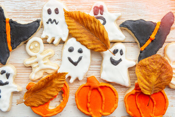 Halloween Jack o Lantern cookies, pumpkin, ghost, black cat, witch hat. Trick or Treat background