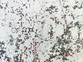 Metal wall background with cracked paint and corrosion