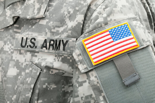 WARSAW, POLAND - JANUARY 26, 2015: Close up studio shot of USA flag and U.S. ARMY patch on solders uniform