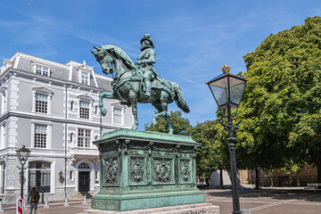 Equestrian statue of Prince William of Orange (1845) on a high pedestal, on which have been placed names of seven regions. The Hague (Den Haag), The Netherlands.