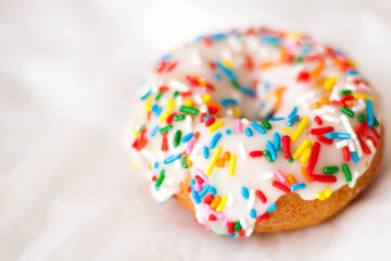 Single Vanilla Donut with Colorful Sprinkles