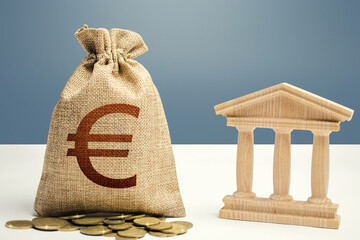 Euro money bag and bank / government building. Budgeting, national financial system. Lending loans,...
