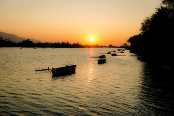 boats in the lagoon at sunset