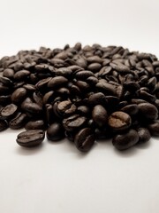 Roast coffee beans on white background