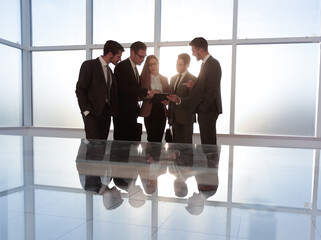 Business woman with her team, a panoramic background