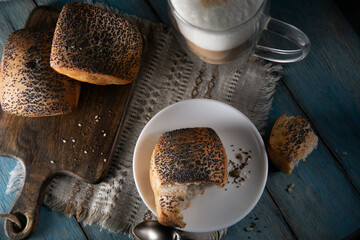 Fresh pastries and coffee on blue wooden table