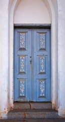Ornate chapel door in historical city of Serro, Minas Gerais, Brazil