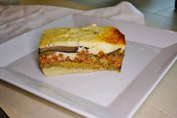 A portion of moussaka, a Greek dish with eggplant and ground meat