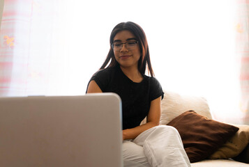 woman on video call with her laptop