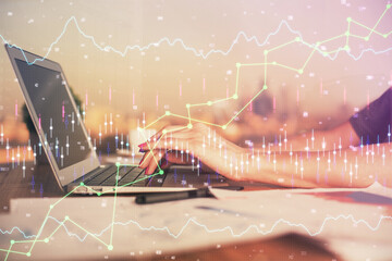 Double exposure of businesswoman hands typing on computer and forex chart hologram drawing. Financial analysis concept.