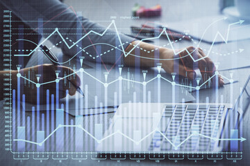 Double exposure of businesswoman hands typing on computer and forex chart hologram drawing. Financial analysis concept.