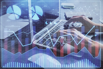 Double exposure of woman hands typing on computer and forex chart hologram drawing. Stock market invest concept.