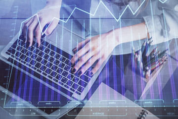 Double exposure of woman hands typing on computer and forex chart hologram drawing. Stock market invest concept.