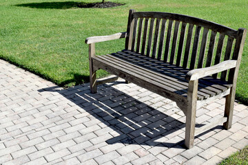 Wooden Bench Along a Walkway