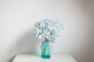 Beautiful flowers in the glass vase.