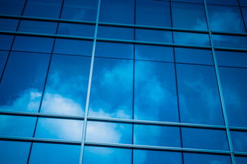 Clouds Reflected in Windows of Modern Office Building.