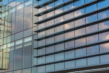 Clouds Reflected in Windows of Modern Office Building.