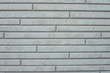 Gray brick wall texture background. Tiled. Close-up