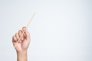 Hand holding decompostable sugarcane straw