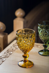 Two colored glass with faceted patterns for wine. Close-up