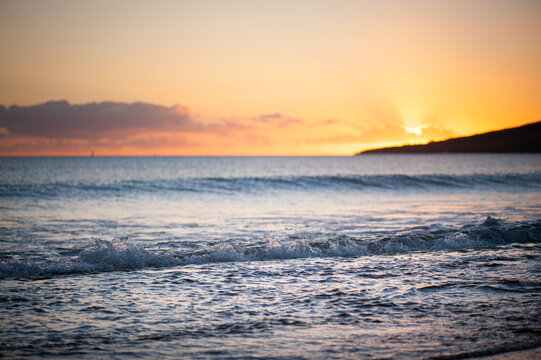 Orange, warm tone sky, Sunset or Sunrise and peaceful waves, Tranquil Landscape Image, dusk or dawn, Hawaii, Maui